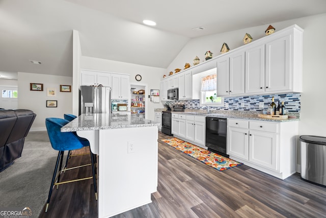 290 Bowers Estates Dr, Hartwell, GA 30643 - kitchen featuring dishwasher, stainless steel fridge, open floor plan, range with electric stovetop, and white cabinets