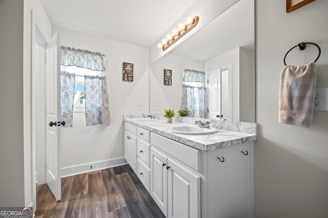 290 Bowers Estates Dr, Hartwell, GA 30643 - bathroom with double vanity, wood finished floors, and baseboards