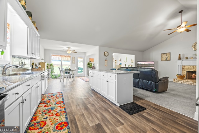 290 Bowers Estates Dr, Hartwell, GA 30643 - kitchen featuring a ceiling fan, open floor plan, a sink, white cabinets, and lofted ceiling