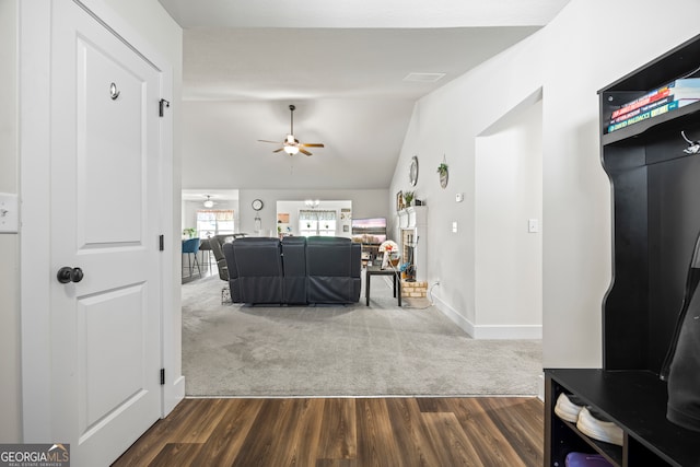 290 Bowers Estates Dr, Hartwell, GA 30643 - hall featuring lofted ceiling, dark colored carpet, dark wood finished floors, and baseboards