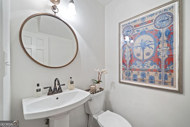 70 Old Ivy Rd NE Unit 57, Atlanta, GA 30342 - half bath featuring a sink and toilet