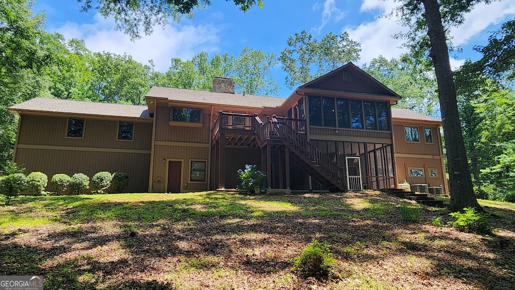 232 Fenwick Wood, Clarkesville, GA 30523 - back of house featuring a sunroom, stairway, a chimney, and a wooden deck