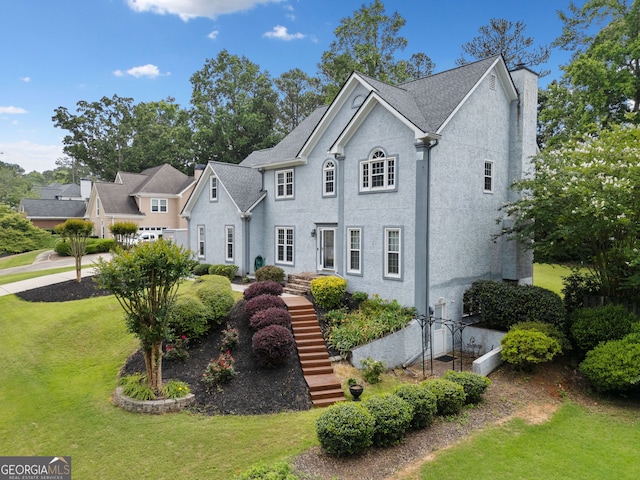 5711 Brynwood Cir NW, Acworth, GA 30101 - view of front facade featuring a front yard, stairs, and stucco siding