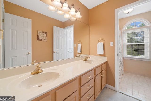 5711 Brynwood Cir NW, Acworth, GA 30101 - bathroom featuring double vanity, a chandelier, and baseboards