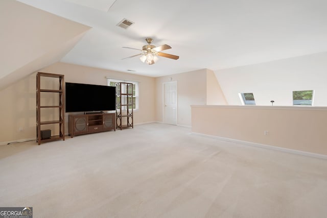 5711 Brynwood Cir NW, Acworth, GA 30101 - unfurnished living room with a ceiling fan, light colored carpet, and baseboards