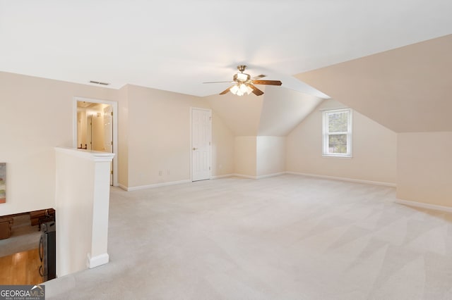 5711 Brynwood Cir NW, Acworth, GA 30101 - additional living space with a ceiling fan, light colored carpet, baseboards, and lofted ceiling