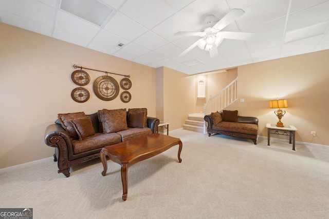 5711 Brynwood Cir NW, Acworth, GA 30101 - living area featuring carpet floors, stairway, a drop ceiling, a ceiling fan, and baseboards