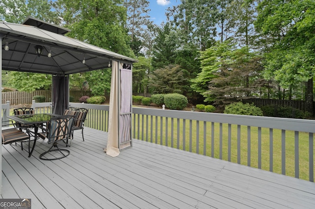 5711 Brynwood Cir NW, Acworth, GA 30101 - wooden terrace with a gazebo, outdoor dining space, and view of scattered trees