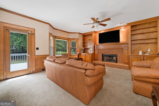 5711 Brynwood Cir NW, Acworth, GA 30101 - living room featuring healthy amount of natural light, carpet flooring, ceiling fan, a wainscoted wall, and ornamental molding
