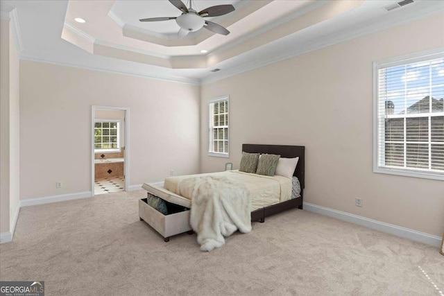 3113 Brians Creek Dr SE, Conyers, GA 30013 - carpeted bedroom featuring a tray ceiling, ornamental molding, recessed lighting, and ensuite bath