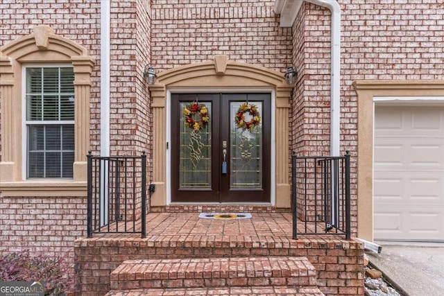 3113 Brians Creek Dr SE, Conyers, GA 30013 - entrance to property with brick siding, french doors, and a garage
