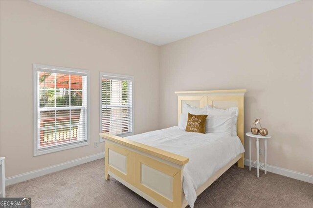 3113 Brians Creek Dr SE, Conyers, GA 30013 - bedroom with light carpet and baseboards