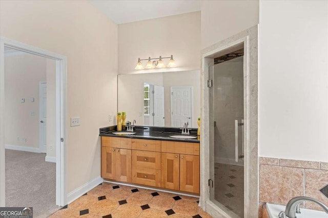 3113 Brians Creek Dr SE, Conyers, GA 30013 - full bathroom with double vanity, a stall shower, and a garden tub