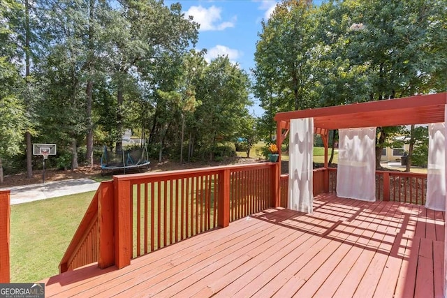 3113 Brians Creek Dr SE, Conyers, GA 30013 - wooden terrace featuring a trampoline and a lawn