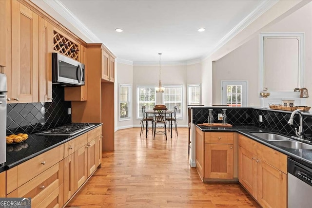 3113 Brians Creek Dr SE, Conyers, GA 30013 - kitchen featuring stainless steel appliances, dark countertops, light wood-style floors, healthy amount of natural light, and ornamental molding