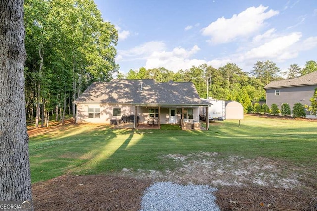 2980 Beards Rd, Buford, GA 30518 - back of house featuring a yard and a shed