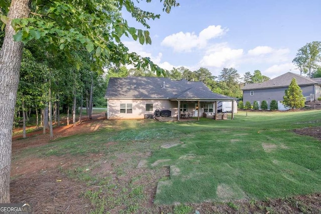 2980 Beards Rd, Buford, GA 30518 - rear view of house featuring a yard