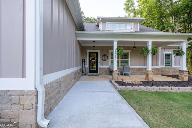 2980 Beards Rd, Buford, GA 30518 - entrance to property with stone siding, covered porch, board and batten siding, and roof with shingles