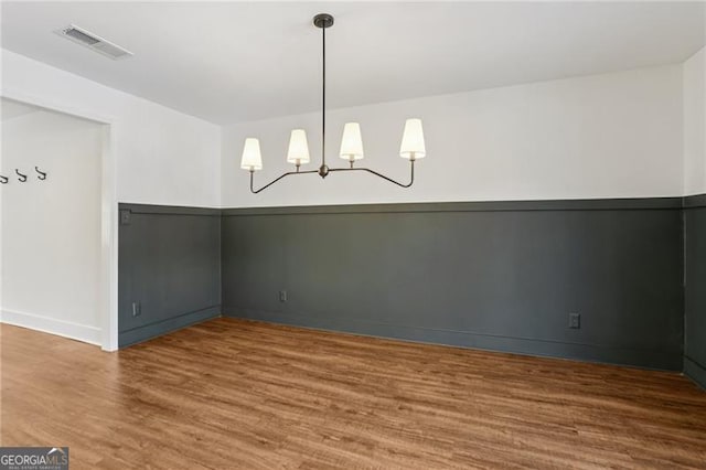 355 Winding River Dr Unit B, Atlanta, GA 30350 - empty room with wood finished floors and a chandelier