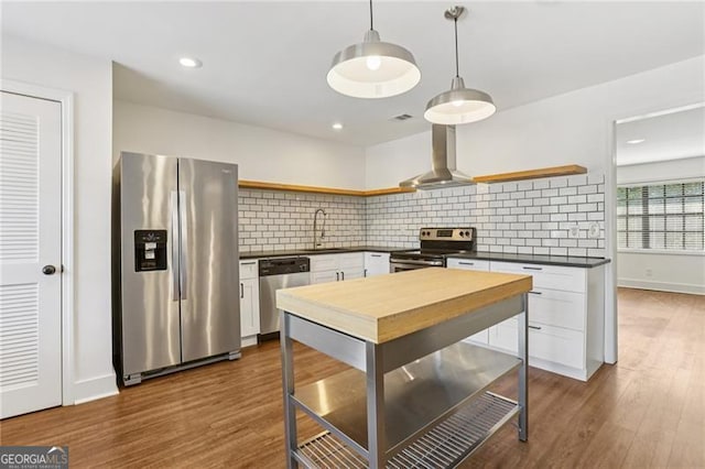 355 Winding River Dr Unit B, Atlanta, GA 30350 - kitchen featuring appliances with stainless steel finishes, open shelves, island range hood, dark countertops, and decorative backsplash