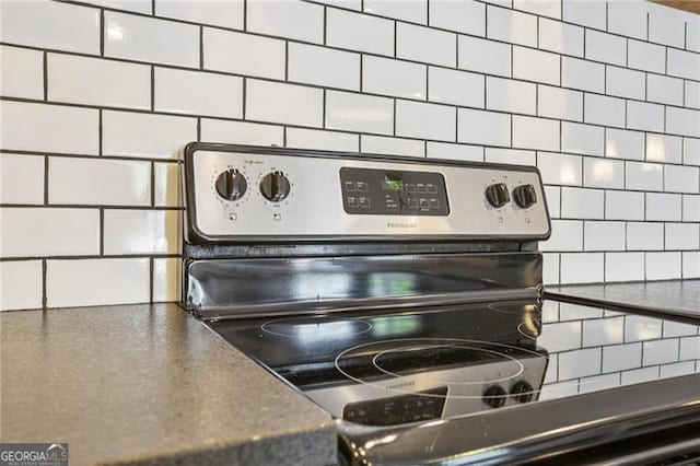 355 Winding River Dr Unit B, Atlanta, GA 30350 - kitchen view of tasteful backsplash, stainless steel electric range oven, and dark countertops