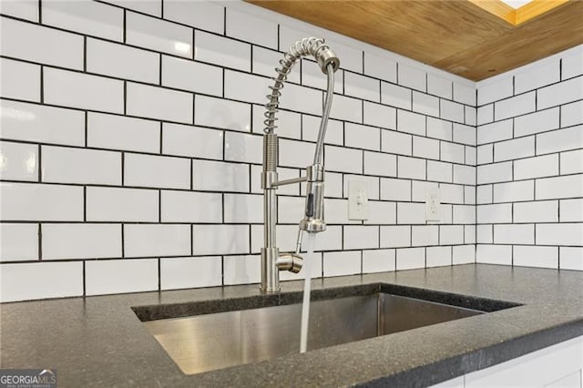 355 Winding River Dr Unit B, Atlanta, GA 30350 - kitchen with decorative backsplash, dark stone countertops, and wooden ceiling
