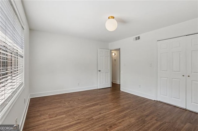 355 Winding River Dr Unit B, Atlanta, GA 30350 - unfurnished bedroom with wood finished floors and a closet
