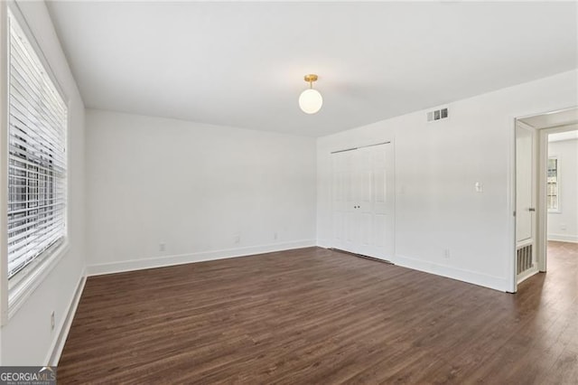 355 Winding River Dr Unit B, Atlanta, GA 30350 - spare room with healthy amount of natural light and dark wood-style floors