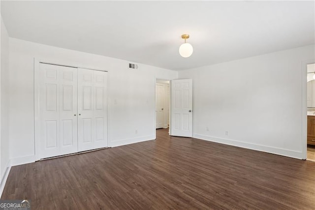 355 Winding River Dr Unit B, Atlanta, GA 30350 - unfurnished bedroom with dark wood-style flooring, a closet, and ensuite bath