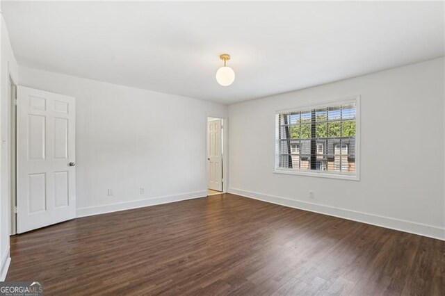 355 Winding River Dr Unit B, Atlanta, GA 30350 - spare room with dark wood-style flooring and baseboards
