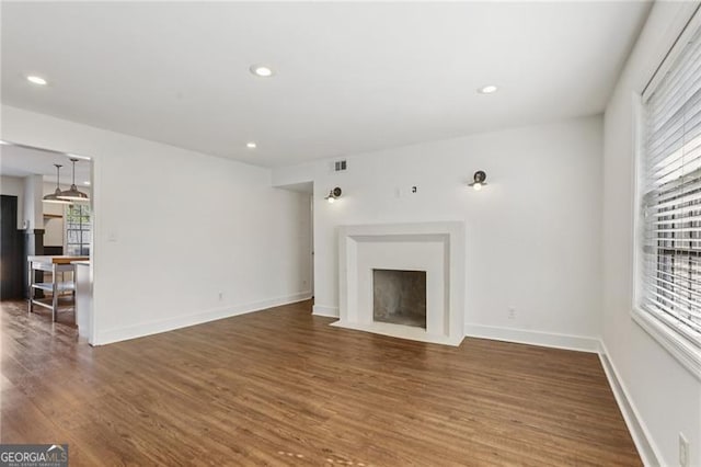 355 Winding River Dr Unit B, Atlanta, GA 30350 - unfurnished living room with wood finished floors, recessed lighting, and a fireplace with flush hearth