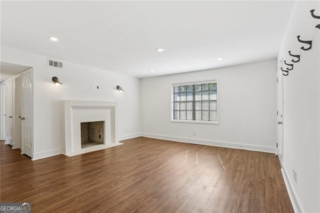 355 Winding River Dr Unit B, Atlanta, GA 30350 - unfurnished living room featuring a fireplace with flush hearth, wood finished floors, and recessed lighting