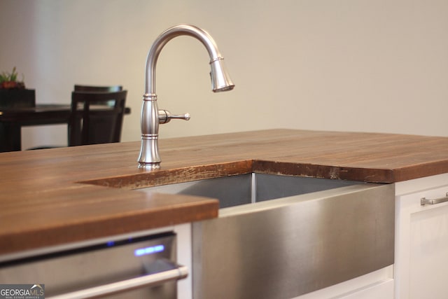 603 W 1st St, Rome, GA 30161 - kitchen view of wooden counters, a sink, and dishwashing machine