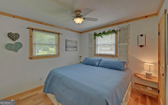 171 Friendship Dr, Hartwell, GA 30643 - bedroom with wood finished floors, multiple windows, ceiling fan, and baseboards