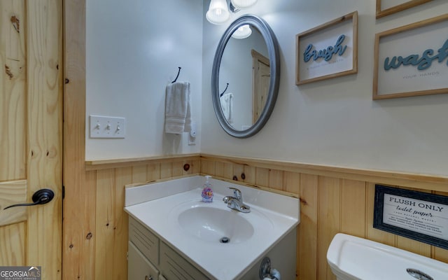 171 Friendship Dr, Hartwell, GA 30643 - half bathroom featuring a wainscoted wall, vanity, and wood walls