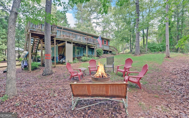 171 Friendship Dr, Hartwell, GA 30643 - rear view of house with an outdoor fire pit, a deck, and stairway