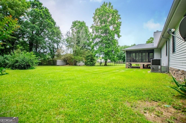 65 Pine Haven Ct, Carrollton, GA 30116 - view of yard with a sunroom and central air condition unit