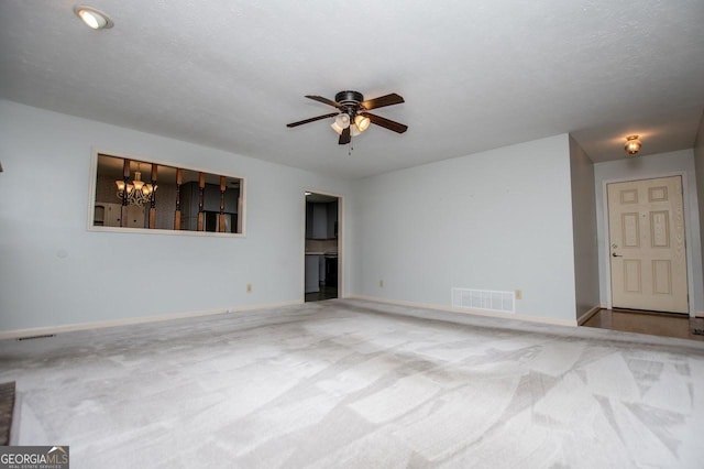 65 Pine Haven Ct, Carrollton, GA 30116 - spare room featuring carpet, a ceiling fan, a chandelier, and baseboards