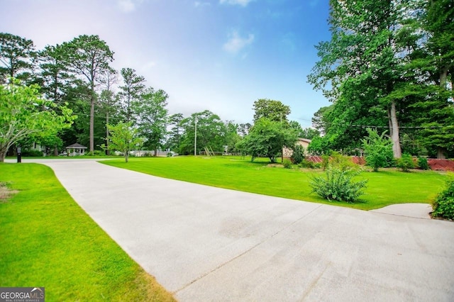 65 Pine Haven Ct, Carrollton, GA 30116 - surrounding community with a yard and view of scattered trees