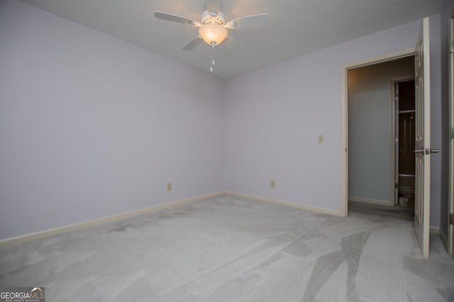 65 Pine Haven Ct, Carrollton, GA 30116 - unfurnished bedroom featuring light carpet, baseboards, and ceiling fan