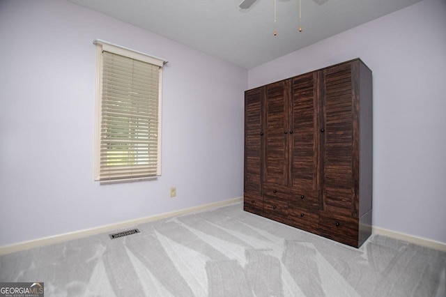 65 Pine Haven Ct, Carrollton, GA 30116 - unfurnished bedroom with carpet flooring, baseboards, and a ceiling fan