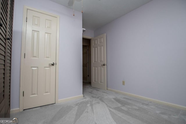 65 Pine Haven Ct, Carrollton, GA 30116 - unfurnished bedroom with carpet, baseboards, and ceiling fan