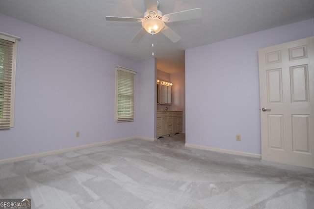 65 Pine Haven Ct, Carrollton, GA 30116 - unfurnished bedroom with carpet flooring, baseboards, ensuite bath, and ceiling fan