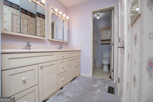 65 Pine Haven Ct, Carrollton, GA 30116 - bathroom featuring vanity, toilet, a shower, and baseboards