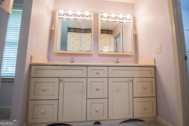 65 Pine Haven Ct, Carrollton, GA 30116 - full bathroom with double vanity and baseboards
