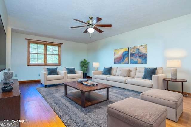 65 Pine Haven Ct, Carrollton, GA 30116 - living room featuring a ceiling fan, wood finished floors, and baseboards