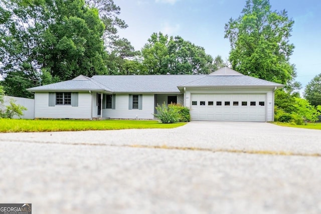 65 Pine Haven Ct, Carrollton, GA 30116 - ranch-style home with an attached garage, concrete driveway, and a front yard