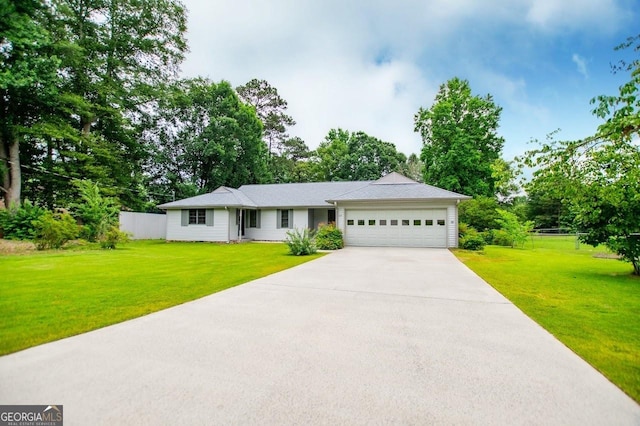 65 Pine Haven Ct, Carrollton, GA 30116 - single story home featuring a garage, driveway, and view of scattered trees
