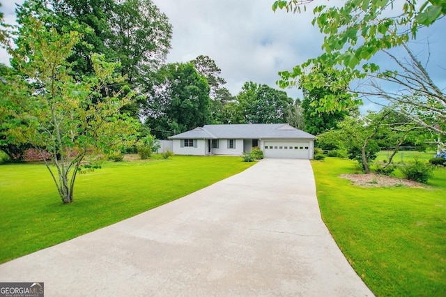 65 Pine Haven Ct, Carrollton, GA 30116 - ranch-style home featuring a garage, concrete driveway, a front yard, and view of wooded area