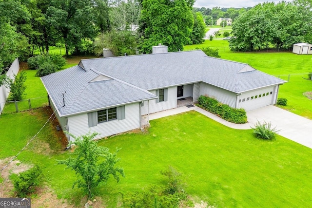 65 Pine Haven Ct, Carrollton, GA 30116 - view of front of property with a chimney, concrete driveway, a shingled roof, an attached garage, and view of scattered trees
